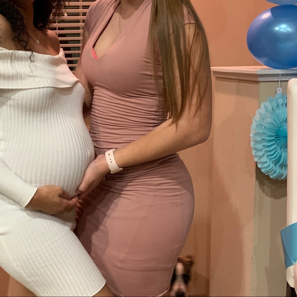 Pink mid body dress.